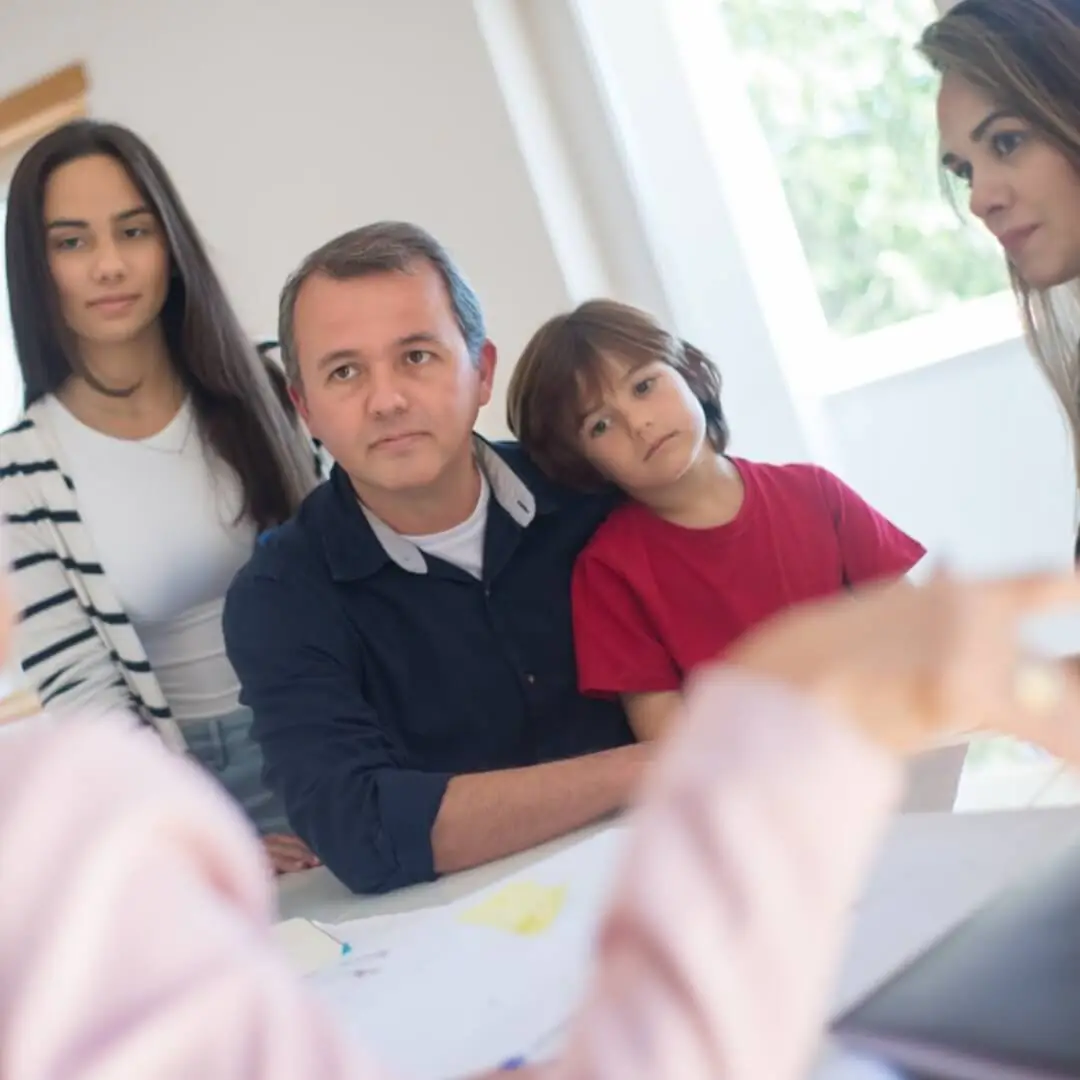 Parent reviewing child support and financial responsibility documents for a blended family
