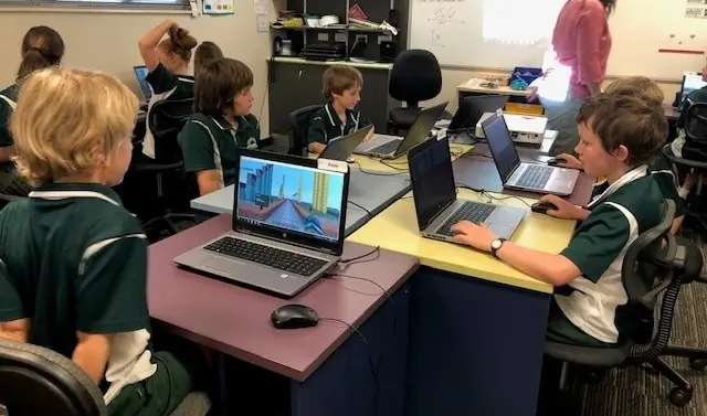 Child building creative project on Minecraft Education screen time benefits vocabulary development