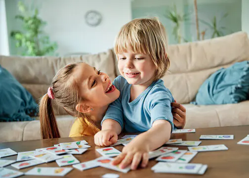 Child asking another player for a card during a game of Go Fish