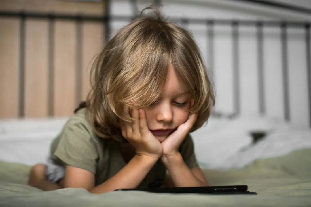 Child playing EndeavorRx FDA authorized prescription video game for ADHD screen time benefits